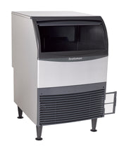 A Scotsman commercial ice machine with a silver body, black top and accents, front vent, and a small open door on the lower right side. This undercounter ice maker stands on four black legs and features a recessed area for easy nugget ice retrieval.