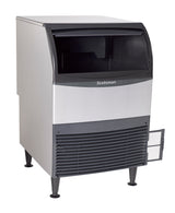 A stainless steel Scotsman undercounter ice maker with a black front panel, open ice bin for fresh nugget ice, and a lower vented grill. The machine stands on four legs, with a small access door open on the right side near the base.