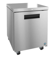 A stainless steel ENERGY STAR commercial undercounter refrigerator with a single door, black handle, lock, and four caster wheels. The sleek reflective surface features a small round blue and white certification badge on the bottom right corner.