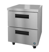 A stainless steel undercounter refrigerator with two large pull-out drawers, black recessed handles, caster wheels, and a blue certification sticker. The unit’s modern commercial design is perfect for professional kitchens.