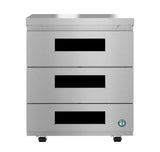 A stainless steel Hoshizaki undercounter refrigerator drawer unit with three horizontal drawers, each featuring a black rectangular handle. The sleek, reflective unit stands on small wheels and displays a certification logo in the bottom right corner.