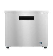A low profile refrigerator, the Hoshizaki UR36B features a sleek silver finish and a black handle, perfect as an undercounter refrigerator for modern kitchens.