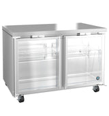 A commercial glass door refrigerator with two clear doors, metal shelving, and secure lock mechanisms. This stainless steel refrigerator features four wheels for mobility and a brushed finish, with the interior empty and clean.