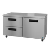 A Hoshizaki stainless steel undercounter refrigerator, this commercial kitchen worktable features two pull-out drawers on the left, a single door on the right, black recessed handles, four caster wheels, and a smooth flat top for food prep.