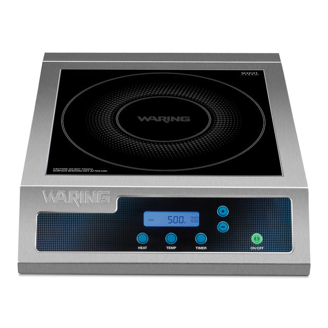 A stainless steel Waring Induction Range countertop single hob with a Schott ceramic glass surface, digital display, and buttons labeled Heat, Temp, Timer, and On/Off. The display shows “500” with illuminated indicator lights.