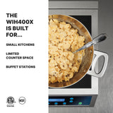 A stainless steel pot of creamy macaroni and cheese with a spoon sits on a Schott ceramic glass induction range. Text on the left reads: THE WIH400X IS BUILT FOR... SMALL KITCHENS, LIMITED COUNTER SPACE, BUFFET STATIONS. ETL and NSF logos are at the bottom.