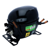 A black, oval-shaped refrigeration compressor for Empura Ice Machines, featuring copper pipes, mounting brackets, and label stickers displaying model and safety info. This Empura Parts compressor has a glossy finish and connectors on both sides.