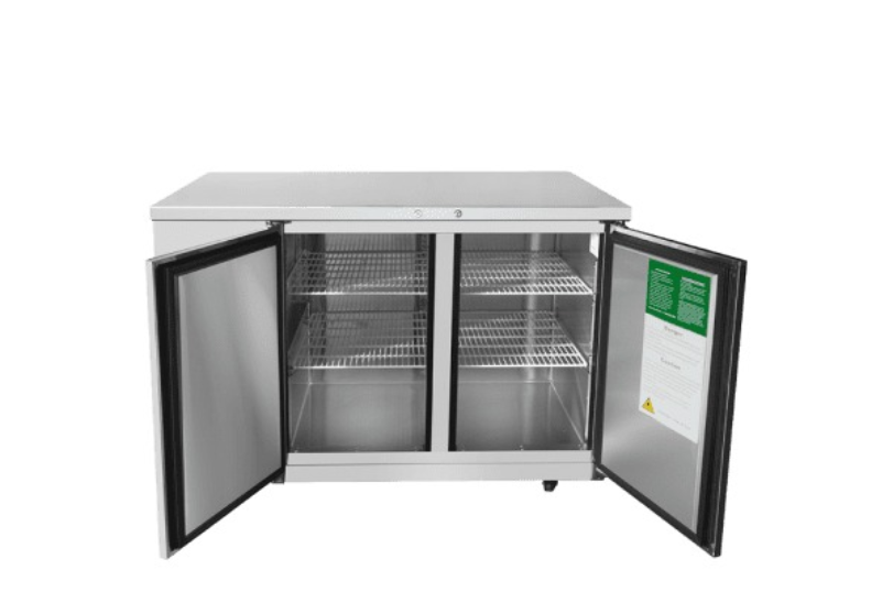 A stainless steel Atosa Back Bar Cooler commercial refrigerator with two open doors revealing three wire shelves inside. Featuring a shallow depth for convenient placement, it also has a green and white instruction label attached to the inside of the right door. The background is plain white.