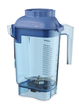 A transparent blue 48 oz Vitamix blender container made from BPA free Tritan, with measurement markings in milliliters and ounces, a right-side handle, left spout, blue lid, and metal blades. The empty jar stands on a white background.