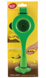 A bright green citrus hand squeezer, crafted from coated zinc alloy, is packaged against a yellow background. The packaging highlights its extra-large capacity, straining pour spout, rubber feet, and ease of use with the TableCraft brand logo at the top.