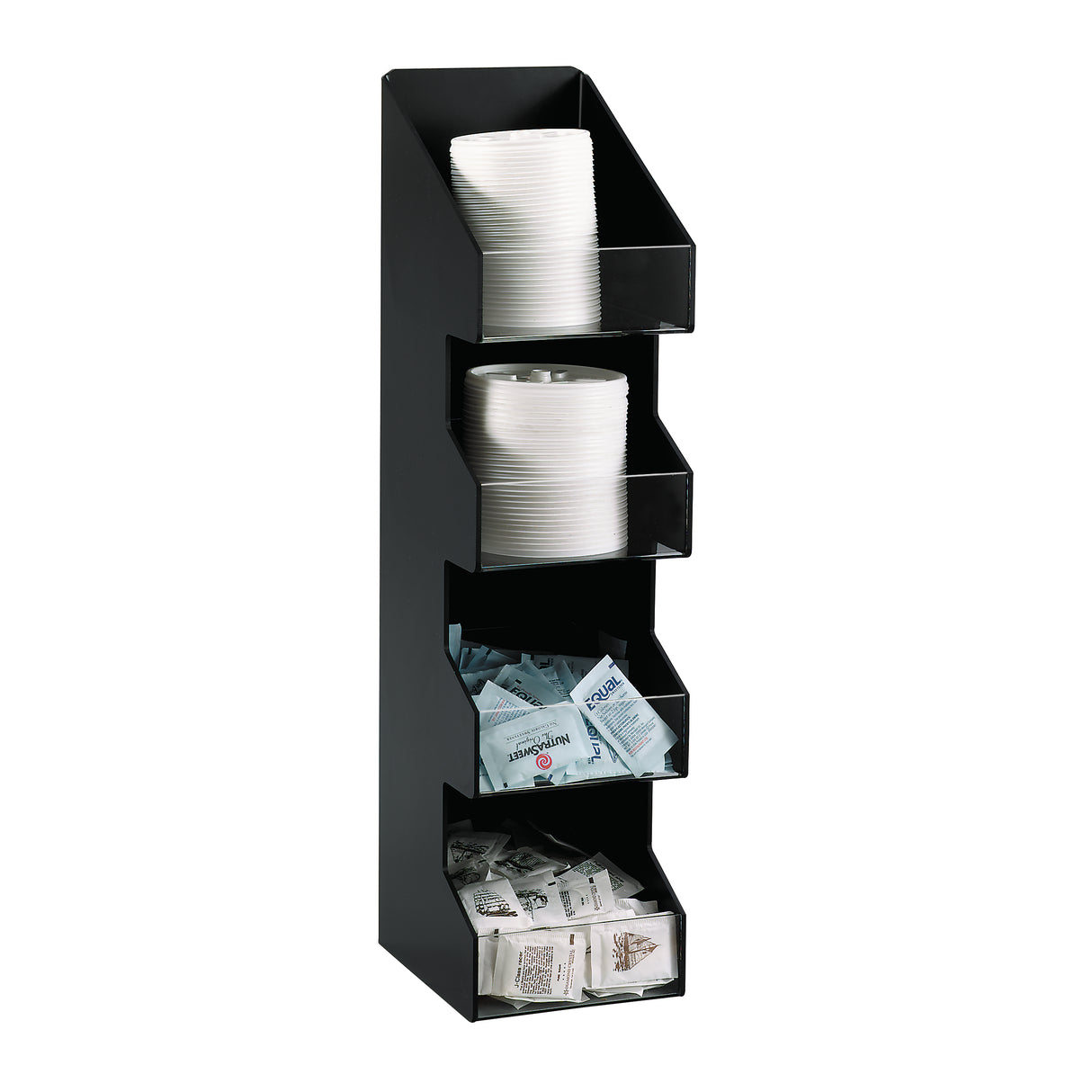 A black, vertical condiment organizer with four angled shelves holds stacks of white paper cups, lids, various sugar and sweetener packets, and condiment packets—all neatly arranged on a countertop against a white background.
