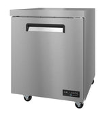 A stainless steel commercial refrigerator from the Valiance Series with a single solid door, recessed handle, and wheels for mobility. The sleek exterior features smooth surfaces and a Valiance by Migali logo at the bottom right corner.