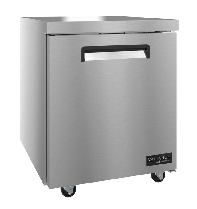 A Valiance Series stainless steel commercial refrigerator with a single front door, recessed handle, and four caster wheels. The brushed metal exterior features a “Valiance” brand logo on the bottom right corner of the door.