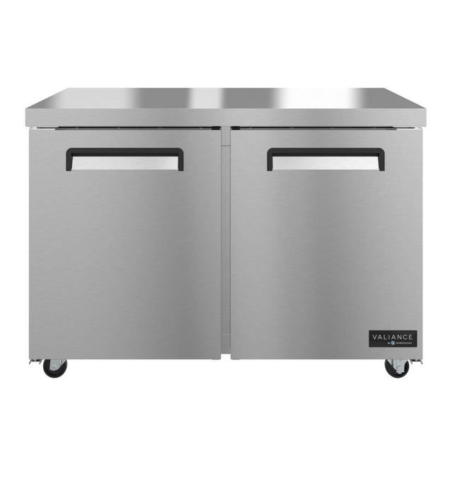 A double-door commercial stainless steel refrigerator or undercounter freezer on wheels, featuring a smooth metallic finish, recessed handles, and the Valiance brand logo in the bottom right corner. The appliance is ENERGY STAR certified and sits on four small caster wheels.