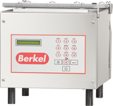 A stainless steel Berkel 250-STD Single Chamber Vacuum Packaging Machine control unit with a keypad, small display screen, and a red Berkel logo beneath the keypad. The unit features numbered and lettered buttons and stands on four black legs.