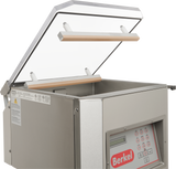 A stainless steel Berkel 350D-STD Single Chamber Vacuum Packaging Machine with an open transparent lid reveals the sealing bars inside. The front control panel features buttons, a digital display, and the signature red Berkel logo.