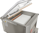 A stainless steel Berkel 350D-STD Single Chamber Vacuum Packaging Machine with its transparent lid open reveals a white sealing platform, a heating bar along the edge, and control labels on the side. The machine is clean and industrial in appearance.