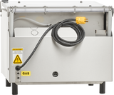 A metallic industrial Single Chamber machine with a hinged clear cover partially open reveals internal wiring. A black power cable with a yellow plug rests on top. Labels read “CAUTION,” feature an electrical hazard symbol, and identify the unit as “GAS.”.