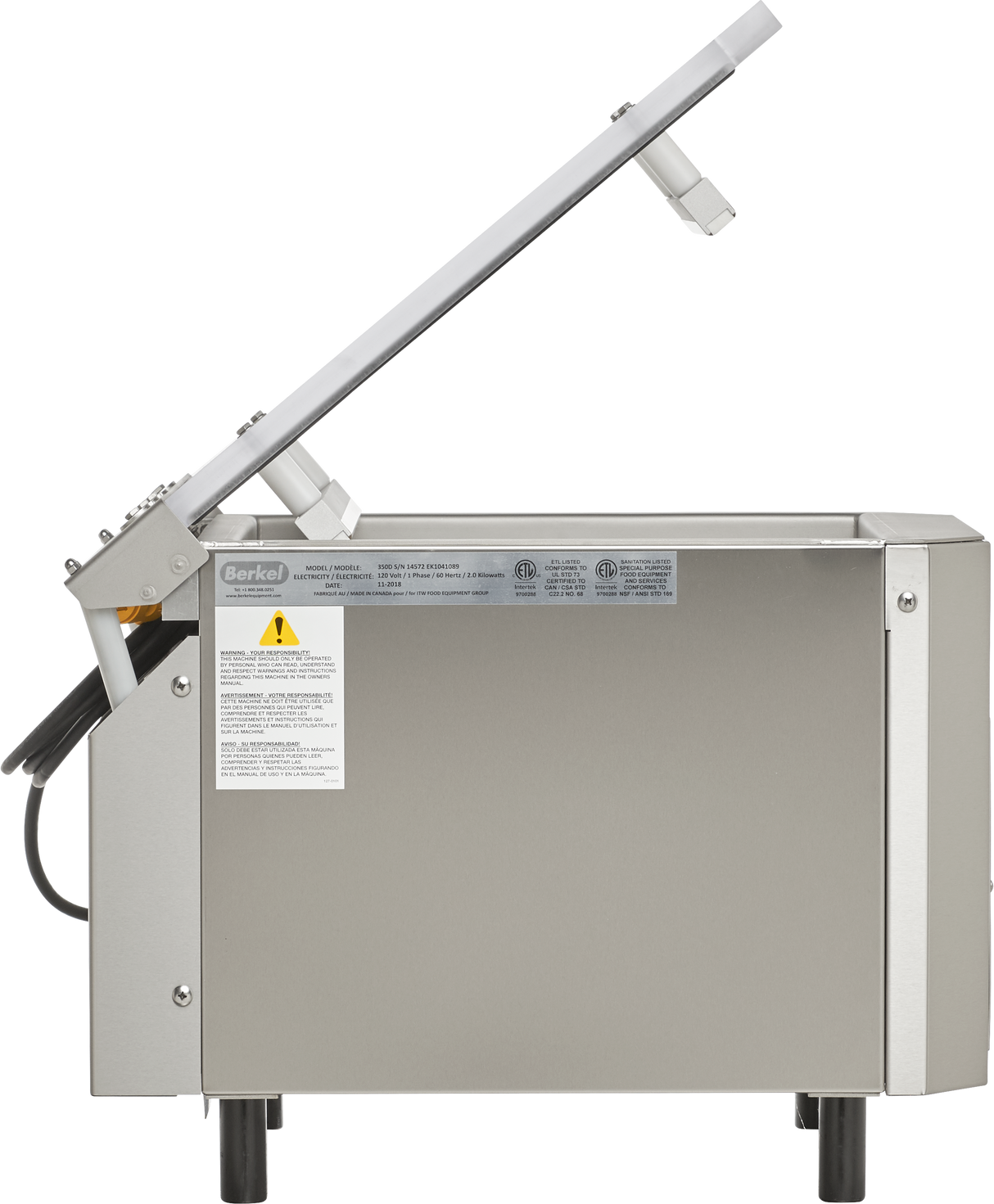 A stainless steel Berkel single chamber vacuum packaging machine is shown side-on with its lid open. The machine features warning labels, simple black legs, and a transparent lid attached with metal arms at an angle.