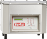 A Berkel single chamber Vacuum Packaging Machine in stainless steel with a rectangular shape. The front panel includes a digital display, a numeric keypad with labeled red buttons, and the red Berkel logo below the display. The top lid is partially open.