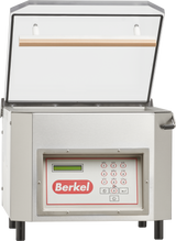 A stainless steel Berkel single chamber vacuum packaging machine with an open transparent lid, digital display, and control panel featuring buttons and a small screen. The Berkel logo is prominently displayed on the front, and the machine stands on four black feet.