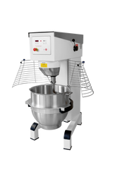 This commercial planetary mixer features a large stainless steel mixing bowl and protective wire guards. The 100 quart mixer has a white body, digital control panel with display screen, and sturdy black-capped legs for stability.