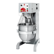 A large commercial planetary mixer with a metal bowl, protective wire guard, and control panel featuring buttons, a knob, and indicator lights, all mounted on a sturdy metal base against a plain white background.