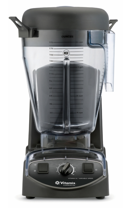 A black Vitamix XL Blender with a large clear plastic pitcher marked with measurements in ounces and liters, a spout, and a black lid. The commercial blender base features a central dial, switches, and branding, set against a plain white background.