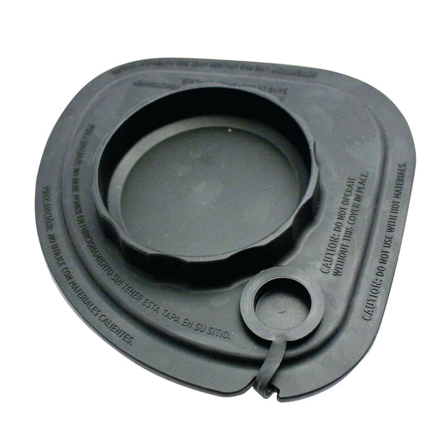 A black, round-edged Vitamix Splash Lid with a large central opening and tethered lid plug. Text in Spanish and English warns against using hot food. The slightly flexible lid is likely designed for Advance containers.