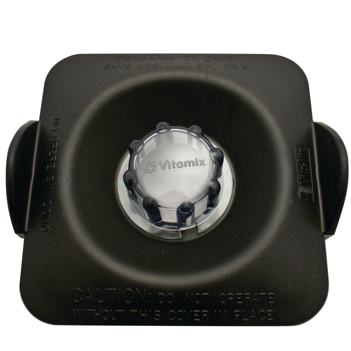 A black Vitamix blender lid made of thermoplastic rubber with a clear circular center cap and Vitamix logo. Designed for a 48 oz container, it has two side handles, embossed caution text, and a matte rectangular surface with rounded corners.