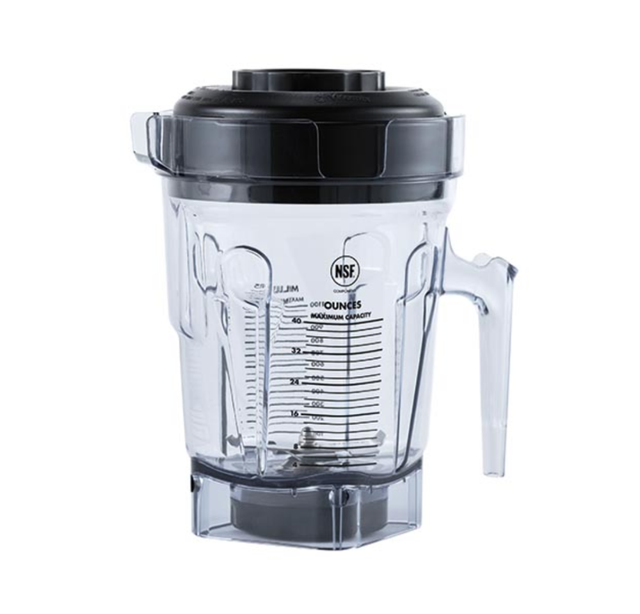 A clear BPA-Free Vitamix blender pitcher with measurement markings, a handle on the right, pouring spout, and black lid. The empty Accelerate Container stands upright with a sturdy base designed to attach to a blender motor.