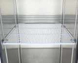 A metal wire shelf inside an empty stainless steel Atosa USA refrigerator or storage unit. The white shelf, held by sturdy shelf clips, features evenly spaced bars and sits in the middle against a reflective, clean metallic interior.