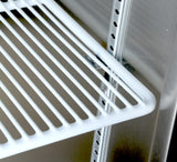 Close-up of an Additional Shelf, model MBF8001GR, inside a stainless steel Atosa USA refrigerator. The white wire shelf is supported by metal brackets slotted into vertical rails. All metal surfaces are clean and reflective.