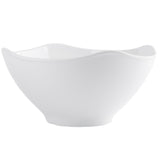 A plain white Frostone Collection Wavy Bowl with gently flared, curved edges and a smooth surface, photographed on a white background. The melamine bowl is empty and features a modern, elegant shape that is also dishwasher safe.
