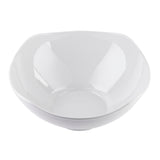 A plain white, glossy ceramic bowl with slightly curved edges and a smooth surface, photographed from above on a white background. This modern wavy bowl is empty and showcases a simple yet stylish design.