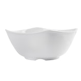 A plain, glossy white Frostone Collection Wavy Bowl with a unique wavy-rimmed design and gently curved sides, set against a white background. This dishwasher safe bowl offers a simple, modern aesthetic and appears empty.