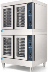 This double-deck commercial convection oven features four glass doors, a stainless steel exterior, multiple wire racks in each compartment, and a Wolf logo on the control panel. The unit stands sturdy on metal legs.
