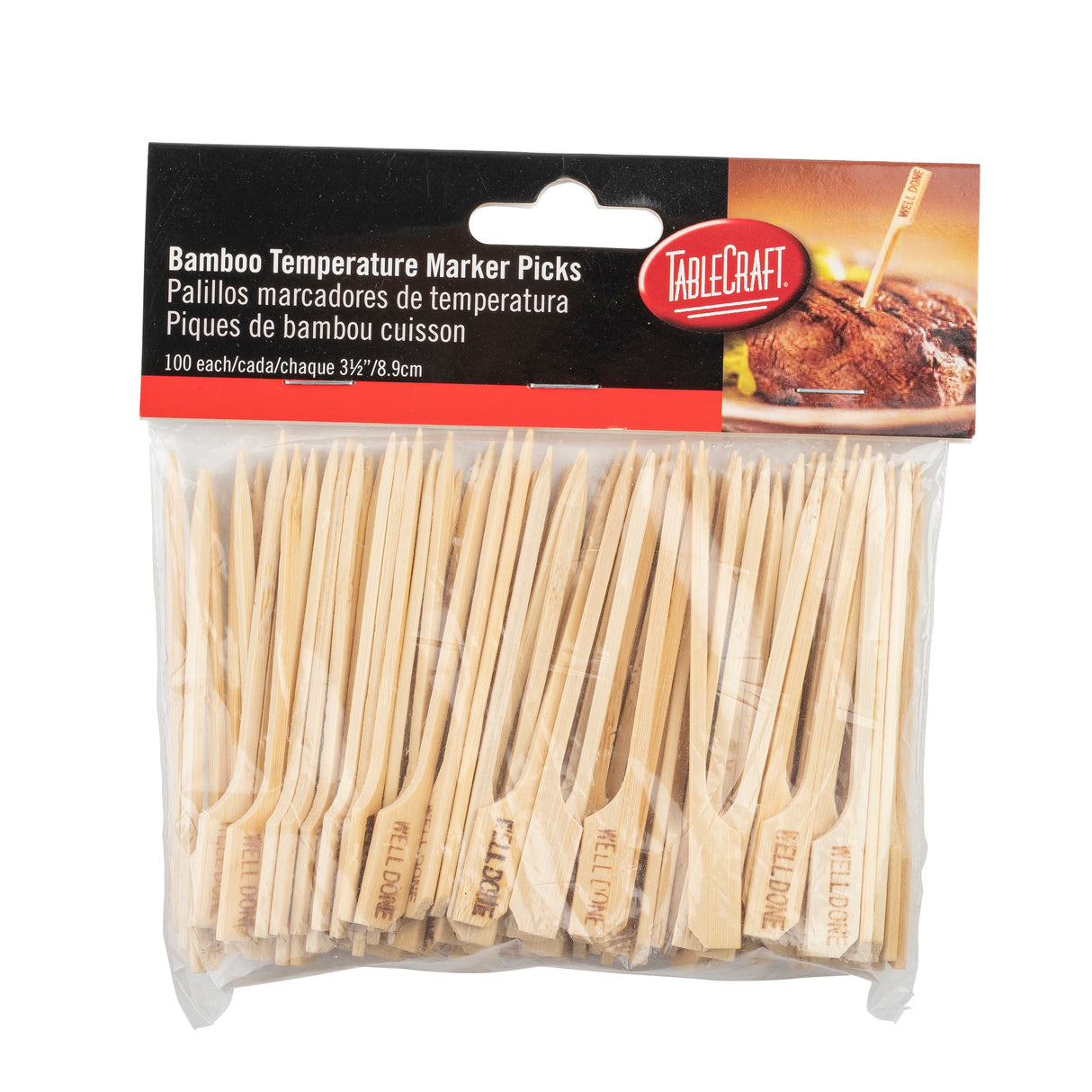 A clear bag of 100 bamboo meat marker picks labeled “TableCraft.” Each pick has “MEDIUM” burned into it. The packaging, in English and Spanish, shows a pick inserted in a steak—ideal for marking steaks from medium to well done.
