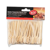 A clear bag of 100 bamboo meat marker picks labeled “TableCraft.” Each pick has “MEDIUM” burned into it. The packaging, in English and Spanish, shows a pick inserted in a steak—ideal for marking steaks from medium to well done.