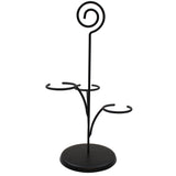 A black powder coated metal stand with a round base, two curved arms for holding items, and a vertical rod topped with a spiral loop. The minimalist design is perfect as a wine glass holder or for showcasing a Cascade Tasting Flight.