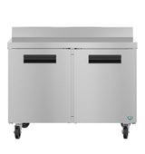 A Hoshizaki stainless steel commercial refrigerator with two doors, black horizontal handles, and four caster wheels. The raised back edge and modern industrial design make it ideal for a professional kitchen or as a worktop freezer.