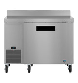 A stainless steel commercial worktop freezer with a digital temperature display, solid door, lower-left ventilation grill, heavy-duty wheels, and a smooth top surface with raised back edge. ENERGY STAR certified for efficient operation.