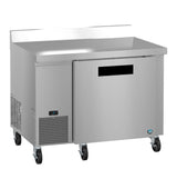A stainless steel worktop freezer on four caster wheels with a single solid door, a digital control panel on the lower left, and a raised back edge. This ENERGY STAR unit boasts a sleek, modern look and is isolated on a white background.