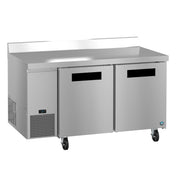 A Hoshizaki commercial stainless steel worktop refrigerator with two front doors, black handle inserts, caster wheels, a digital display on the lower left, and a raised backsplash along the back edge, set against a plain white background.