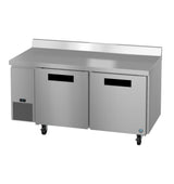 A stainless steel commercial worktop freezer with two doors, an ENERGY STAR rating, digital temperature display, black handles, flat prep surface, raised backsplash, and wheels for mobility, viewed from the front angle.
