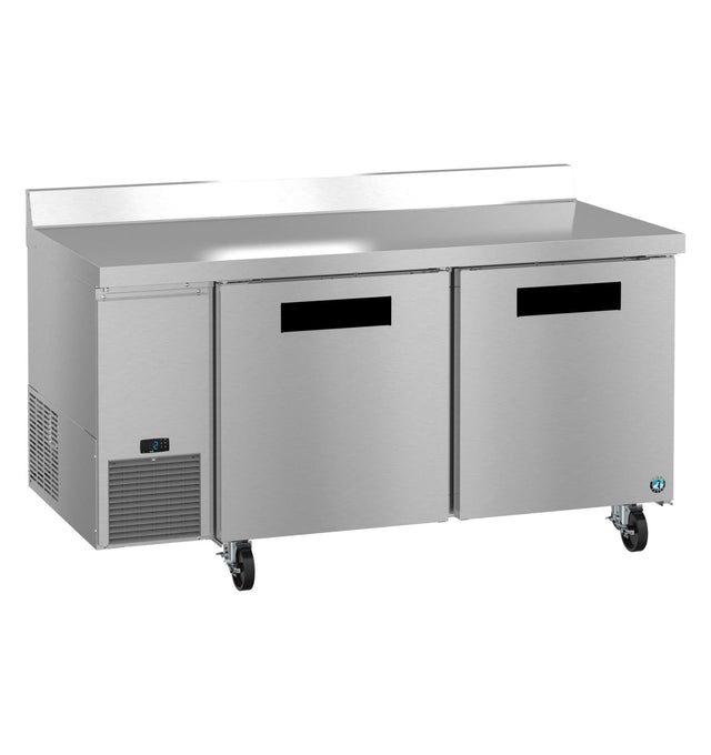 A large ENERGY STAR stainless steel commercial refrigerator with two front doors, a digital control panel, ventilation grilles, backsplash, smooth countertop, and caster wheels. Its sleek, industrial design is ideal for any modern kitchen setting.