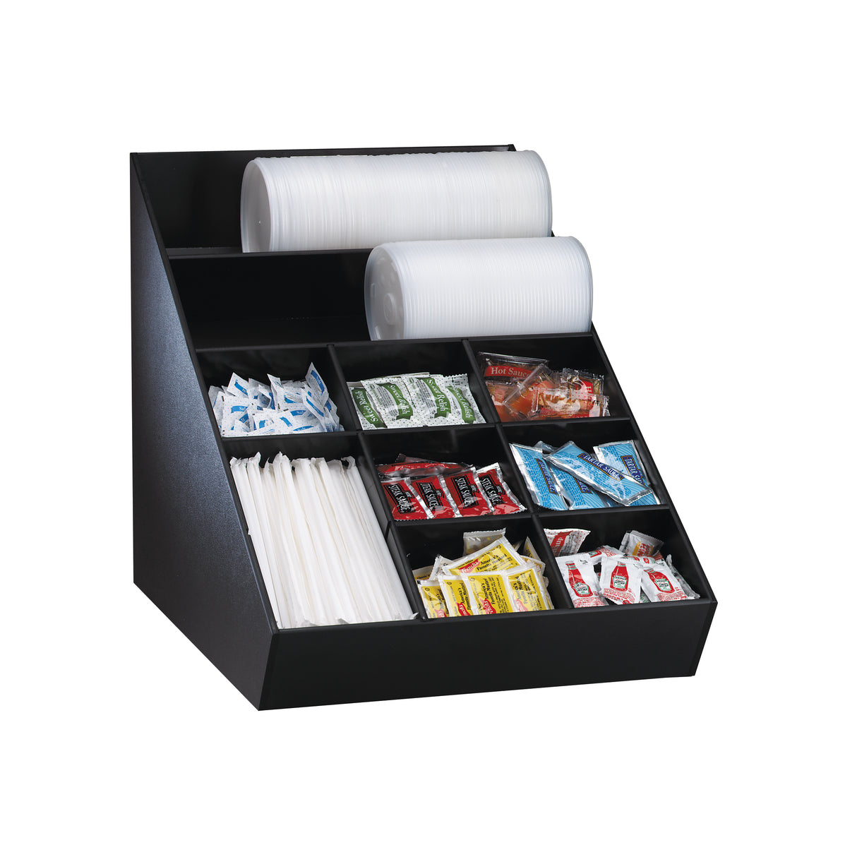 A black condiment organizer holds white paper cups, lids, white straws, sugar packets, sweetener packets, salt, pepper, ketchup, mustard, and condiment packets in separate compartments, all neatly arranged against a plain white background.