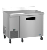 A stainless steel worktop refrigerator with one solid door, ENERGY STAR certification, a ventilation grill on the lower left, digital display, four caster wheels, and a raised backsplash—all set against a white background.