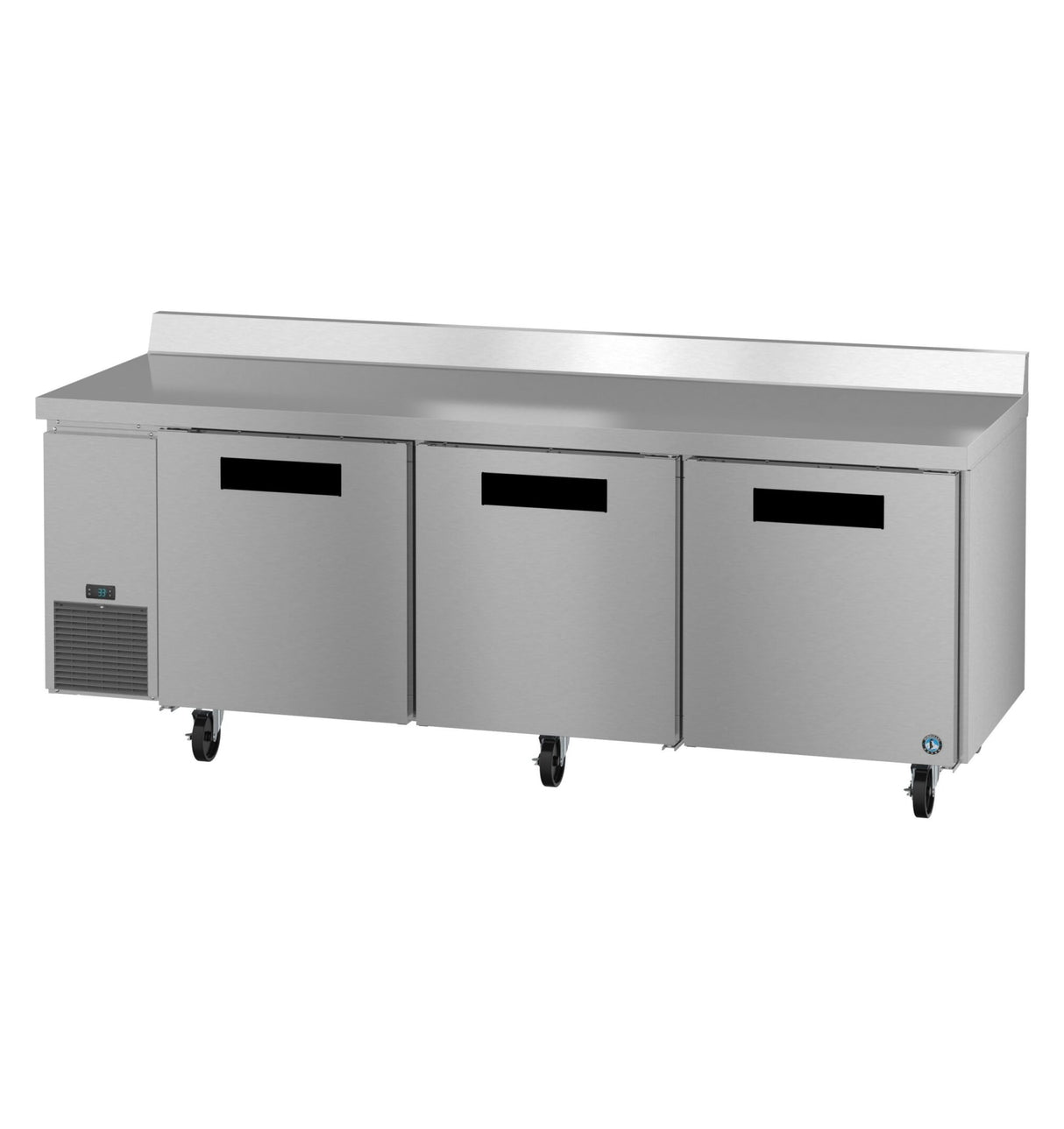 A large stainless steel worktop refrigerator with three front doors on wheels, a flat countertop, and a raised backsplash. The unit features a small vent and control panel on the left side and an ENERGY STAR logo in the lower right corner.