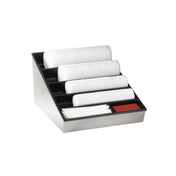 A sleek black and metallic lid organizer holds stacked white plastic lids in four angled rows, alongside red and white stirrers in two front compartments. This stylish countertop condiment organizer is perfect for dispensing coffee accessories. The background is plain white.